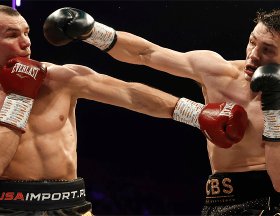 Masternak retired in his corner after appearing to sustain a rib injury.Credit: Richard Crease