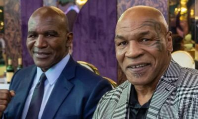 Mike Tyson and Evander Holyfield smiling