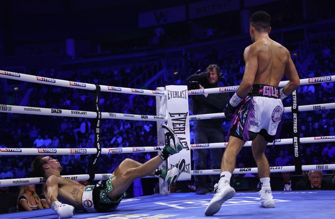 Gill celebrates beating Conlan as referee Howard Foster calls a halt to the contest Photo Credit: Mark Robinson/Matchroom Boxing