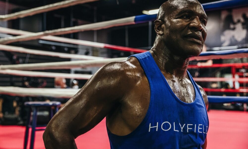 On This Day: When Evander Holyfield And Michael Dokes Gave Us A Heavyweight War To Cherish