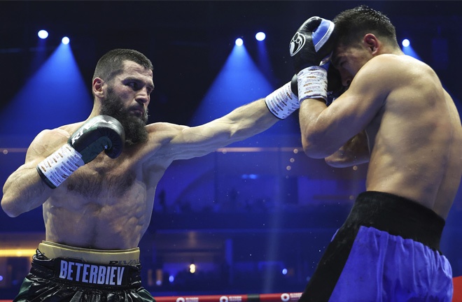 Beterbiev celebrates after beating Bivol to become undisputed champion Photo Credit: Leigh Dawney/Queensberry Promotions