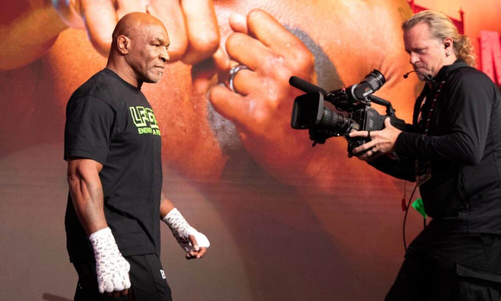 Mike Tyson walking towards a camera