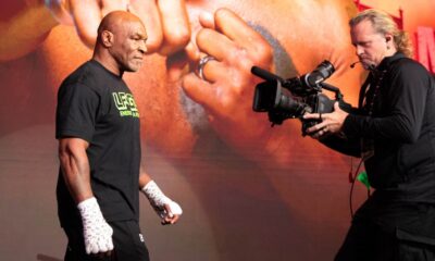 Mike Tyson walking towards a camera