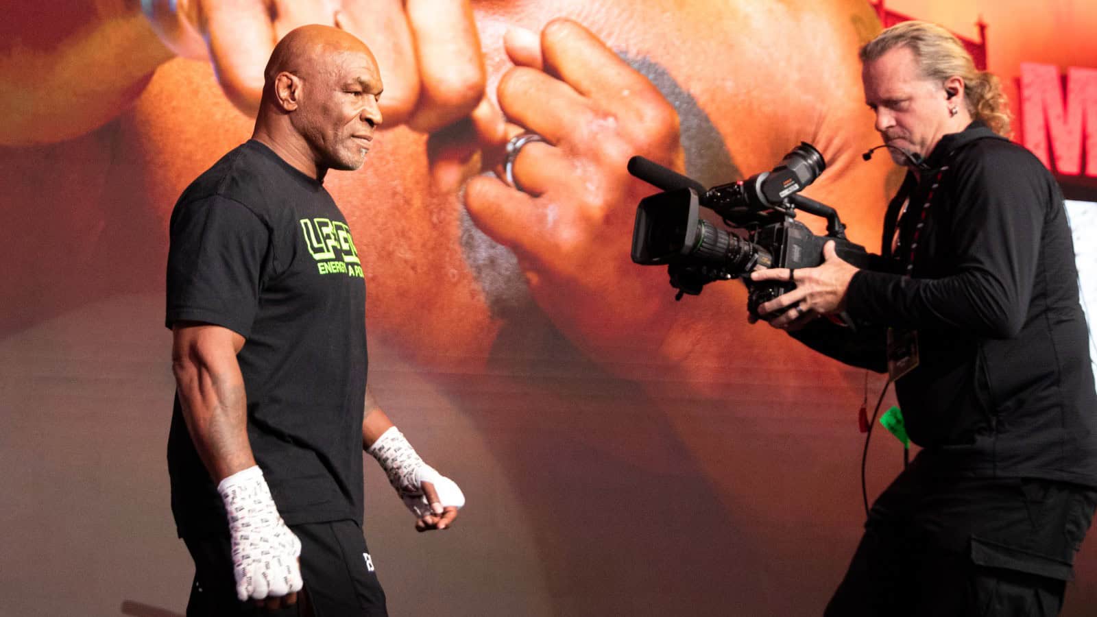 Mike Tyson walking towards a camera