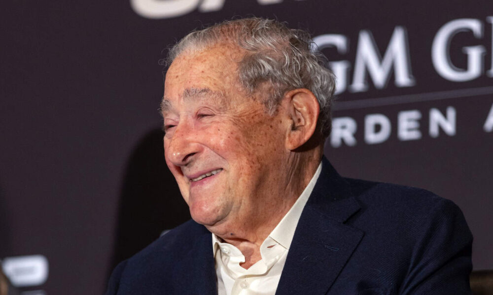 Bob Arum smiling at a press conference