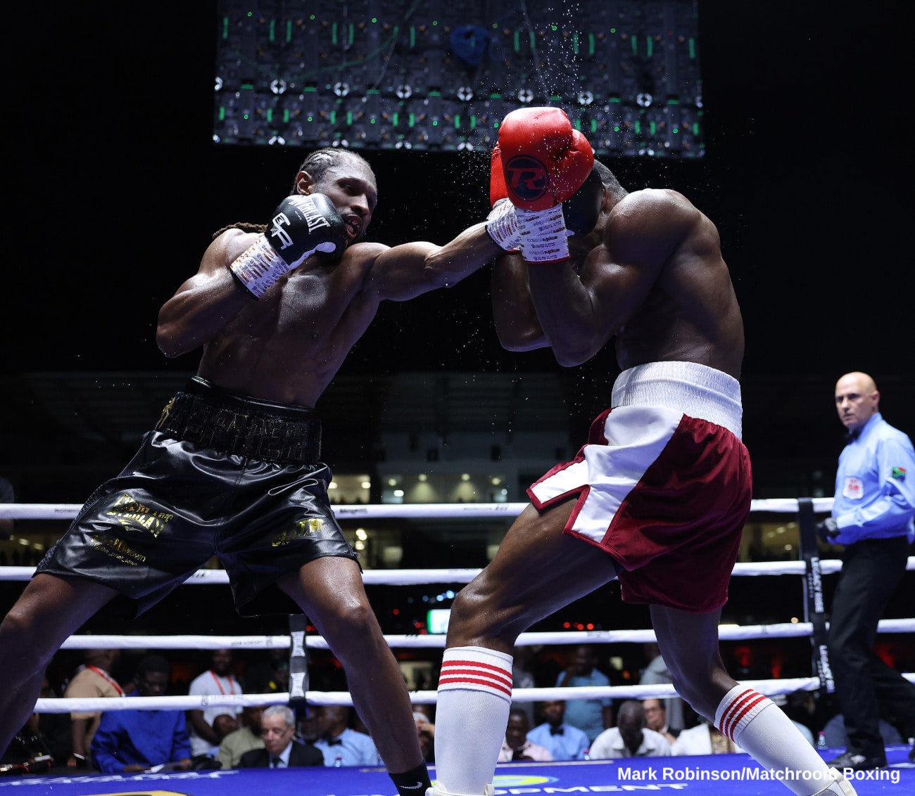 Craig Richards lands a punch on Dan Azeez during their light heavyweight bout at Legon Sports Stadium in Accra, Ghana.