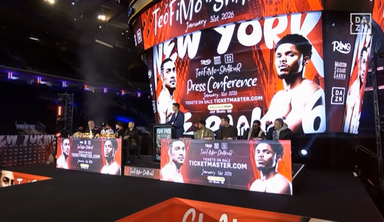 Wide shot of the press conference stage for Teofimo Lopez vs Shakur Stevenson with promotional graphics on screen.