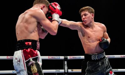 Giorgio Visioli throws a right hand at Joe Howarth during their English lightweight title fight in London.