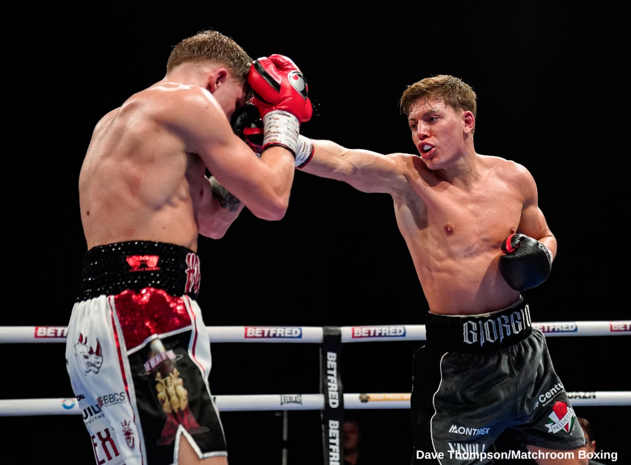 Giorgio Visioli throws a right hand at Joe Howarth during their English lightweight title fight in London.