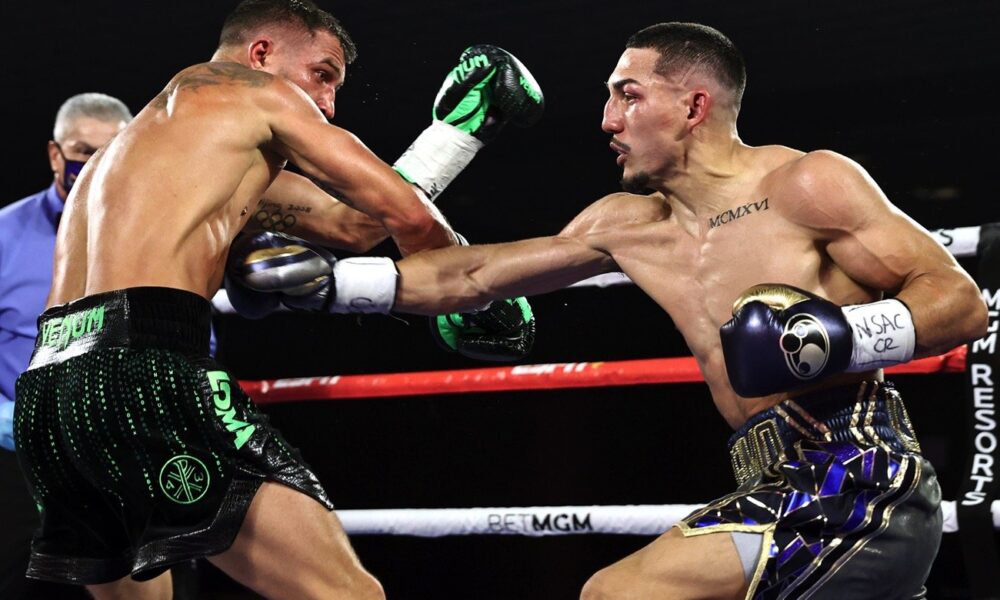 Teofimo Lopez lands a right hand on Vasily Lomachenko during their lightweight title fight on October 17, 2020, inside The Bubble at MGM Grand in Las Vegas.