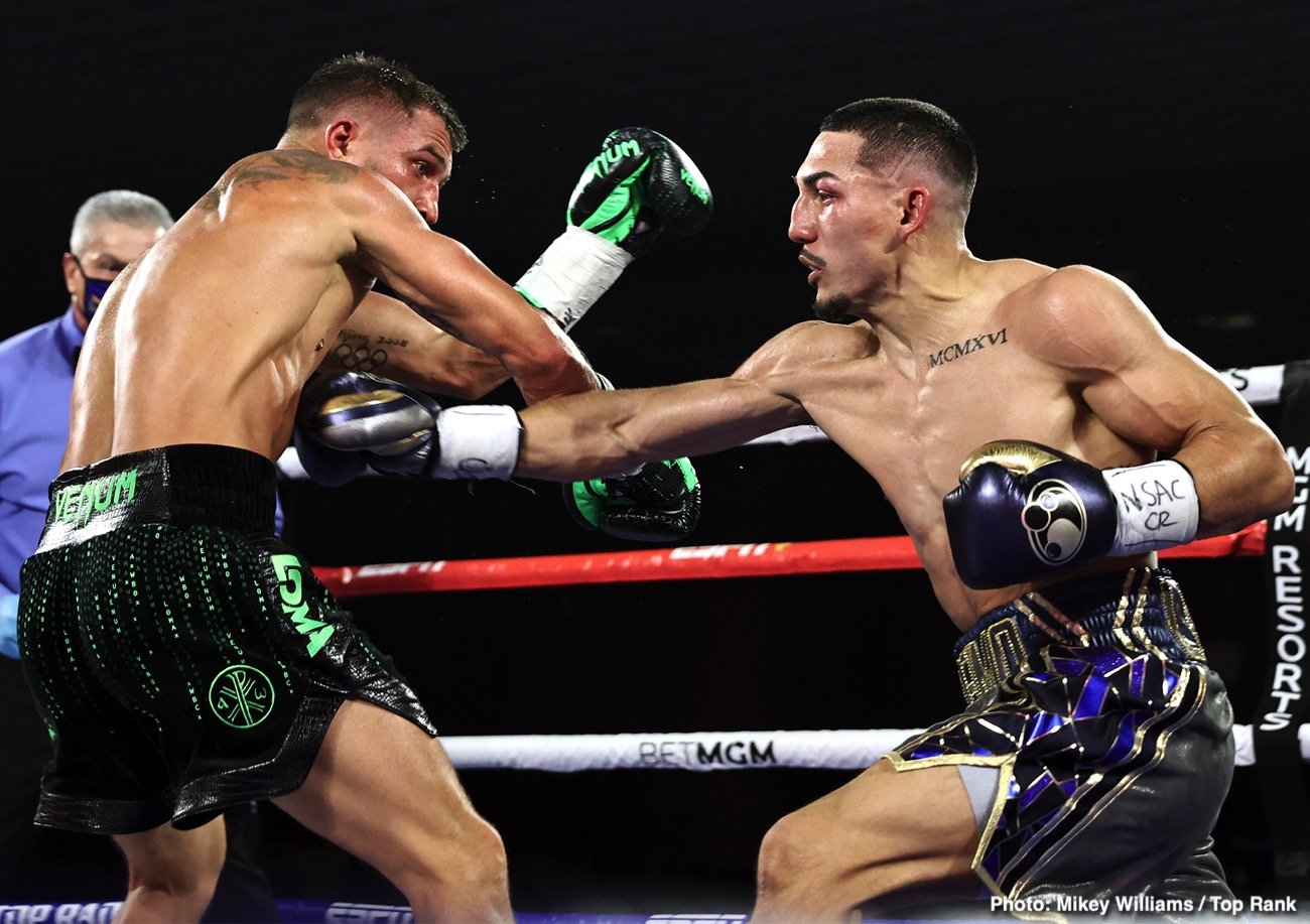 Teofimo Lopez lands a right hand on Vasily Lomachenko during their lightweight title fight on October 17, 2020, inside The Bubble at MGM Grand in Las Vegas.