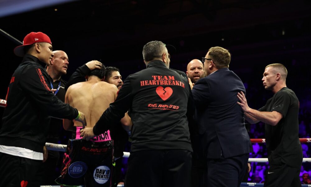 Andrew Cain confronts members of Brandon Figueroa’s team following the Ball–Figueroa bout.