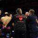 Andrew Cain confronts members of Brandon Figueroa’s team following the Ball–Figueroa bout.