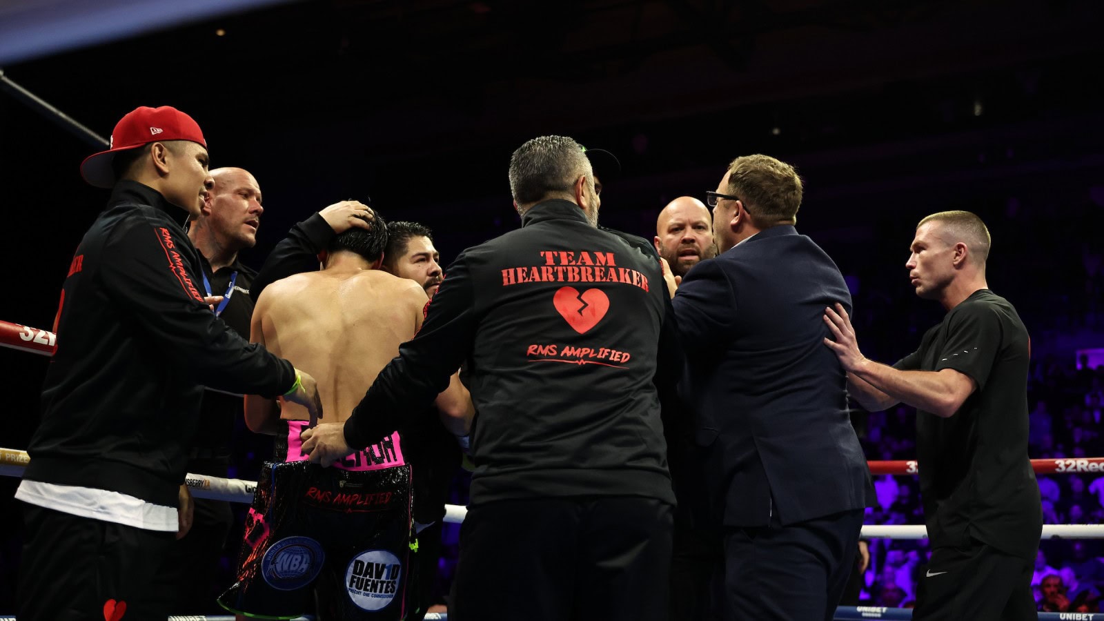 Andrew Cain confronts members of Brandon Figueroa’s team following the Ball–Figueroa bout.