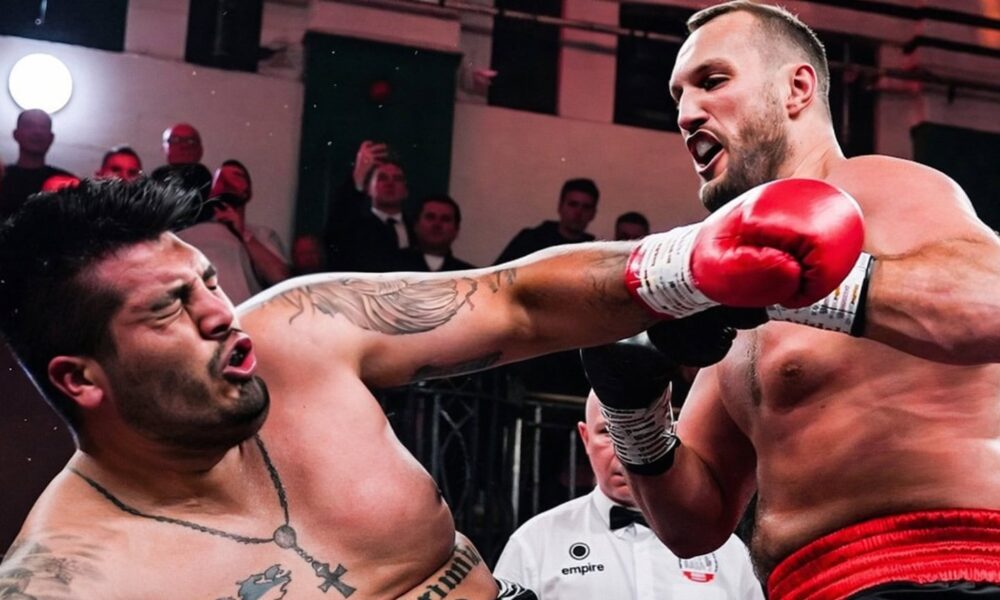 Nelson Hysa lands a powerful right hand on Ariel Esteban Bracamonte during their heavyweight bout, with Bracamonte’s head snapping back