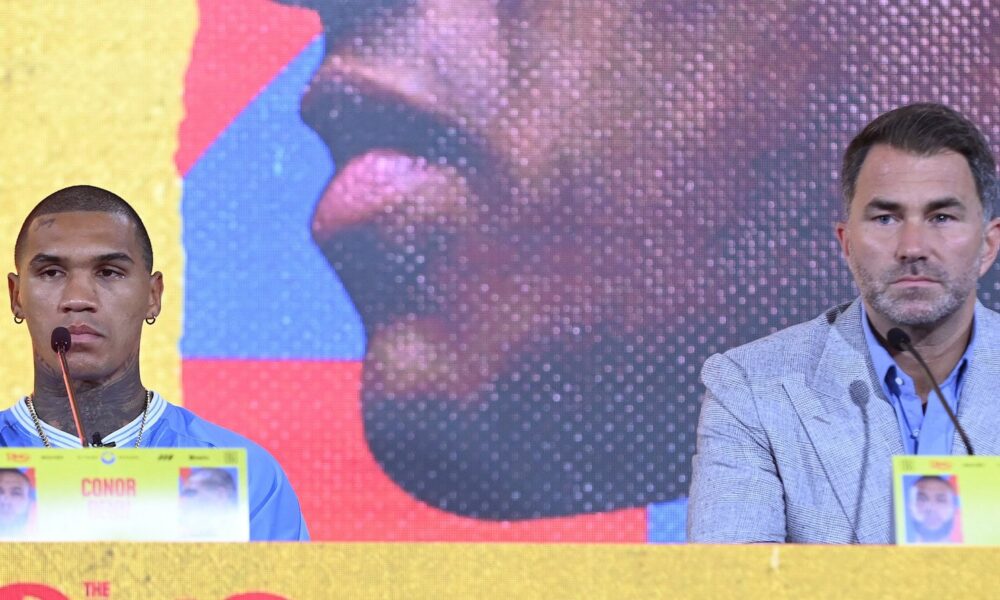 Conor Benn and Eddie Hearn at the Chris Eubank Jr rematch press conference looking stern