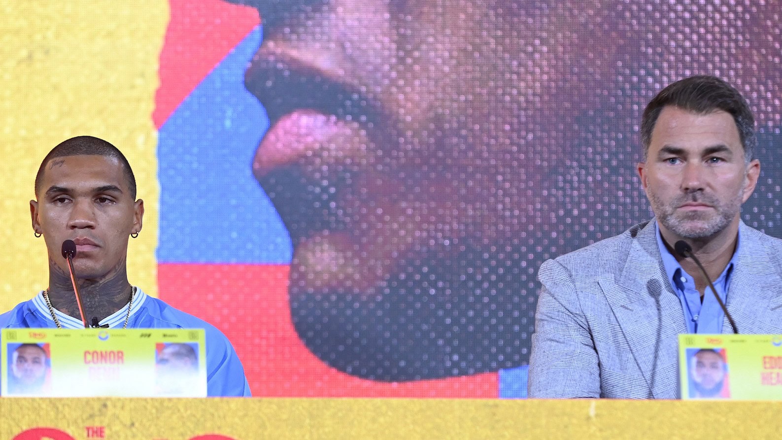 Conor Benn and Eddie Hearn at the Chris Eubank Jr rematch press conference looking stern