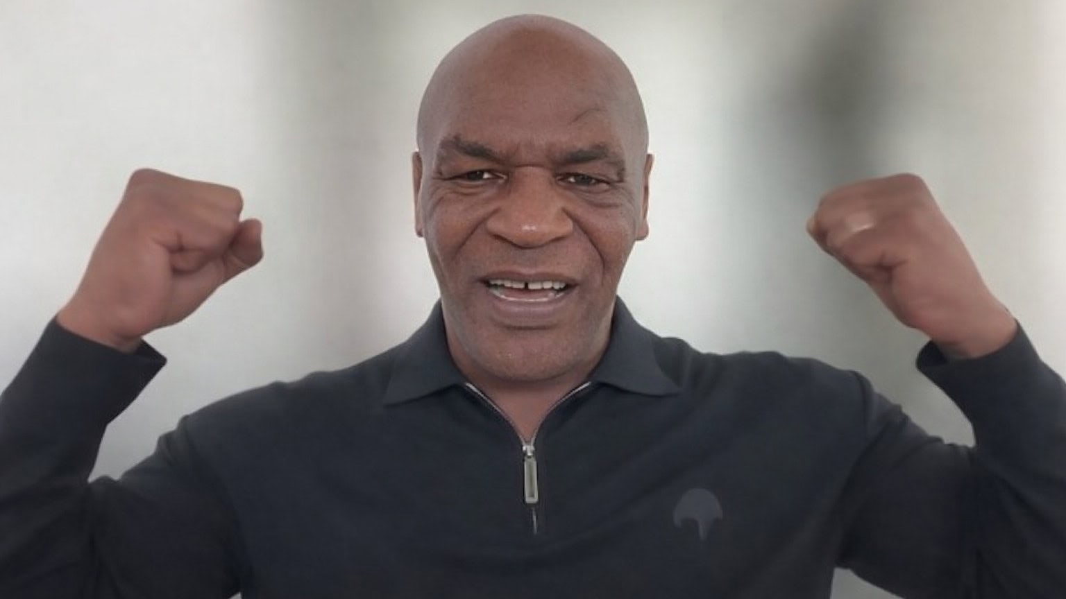 Mike Tyson flexes his arms while showing slimmer physique ahead of potential Floyd Mayweather fight