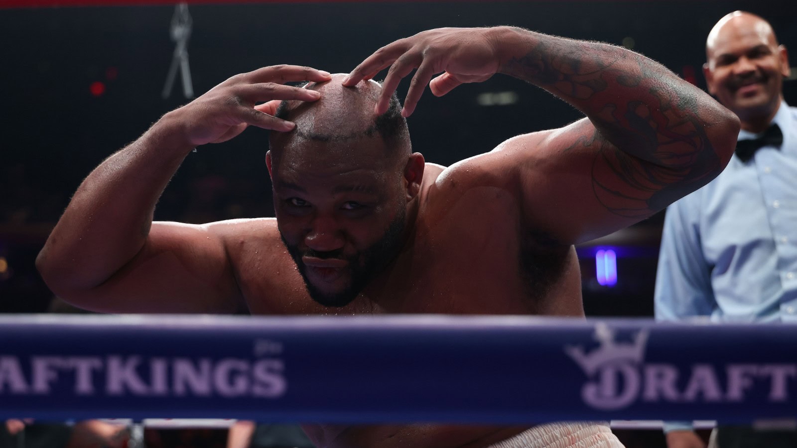Jarrell Miller poses without his toupee at the end of his fight against Kingsley Ibeh