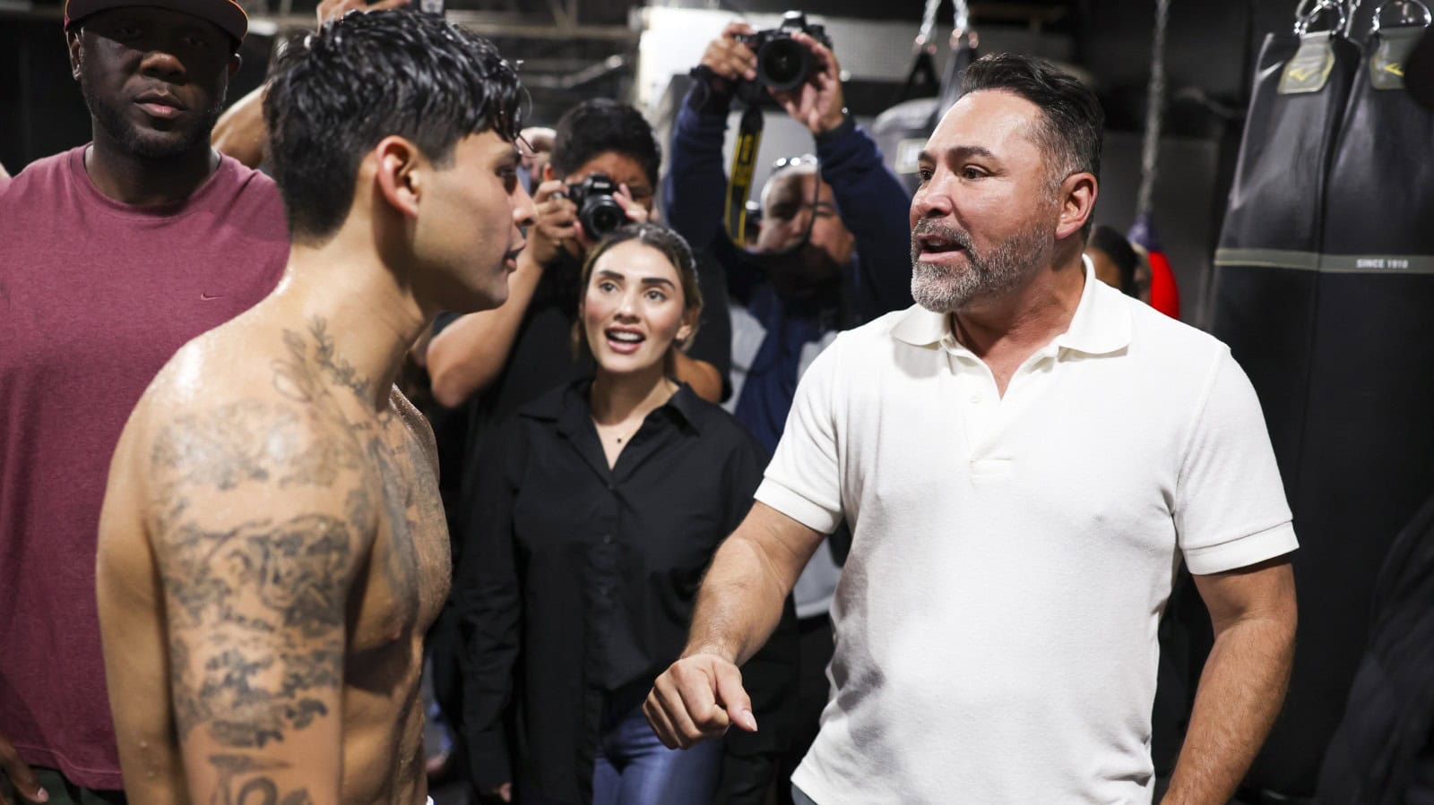 Ryan Garcia and Oscar De La Hoya chat at an open workout