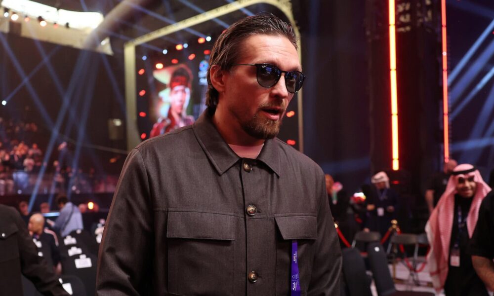 Oleksandr Usyk pictured in New York at the Lopez vs Stevenson fight, seated ringside in casual attire during the event.