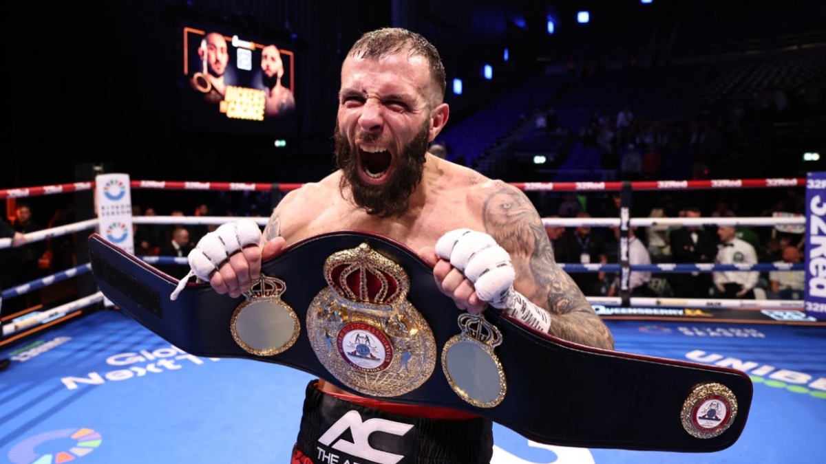 Anthony Cacace celebrates after defeating Jazza Dickens to win the WBA super featherweight title in Dublin