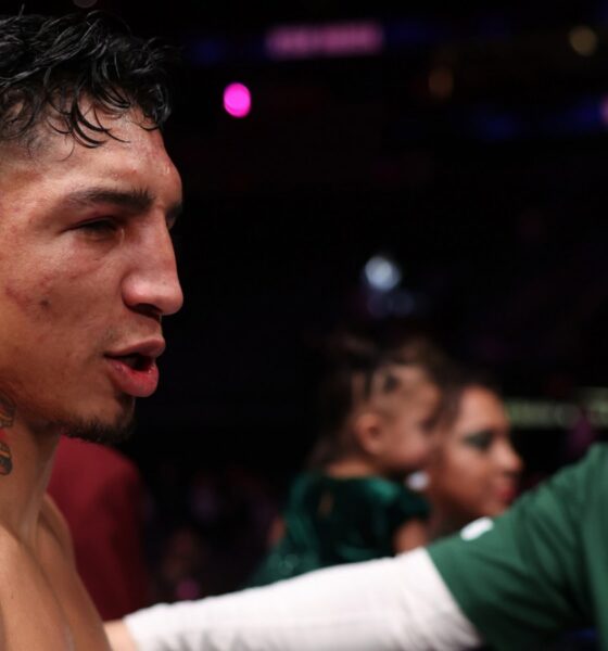 Mario Barrios with trainer Bob Santos following a fight as plans for a move to 154 pounds are discussed