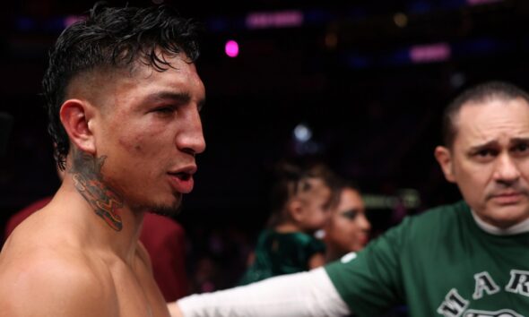 Mario Barrios with trainer Bob Santos following a fight as plans for a move to 154 pounds are discussed