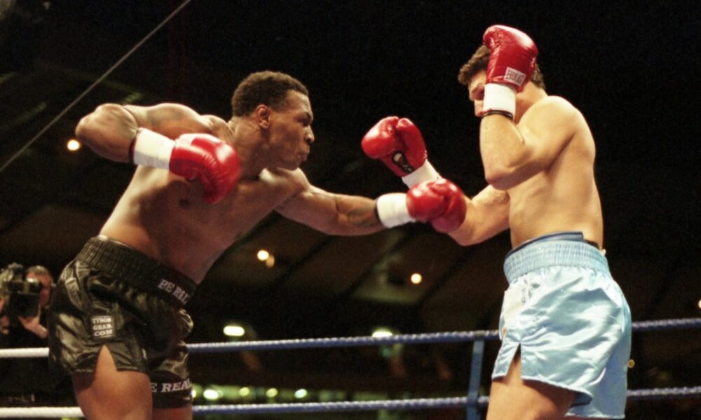 Mike Tyson throwing a punch in his professional career vs Lou Savarese
