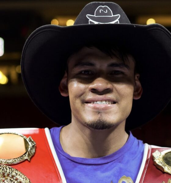 Emanuel Navarrete poses with WBO and IBF super featherweight titles after defeating Eduardo Nunez in 2026