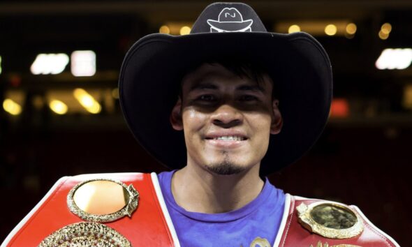 Emanuel Navarrete poses with WBO and IBF super featherweight titles after defeating Eduardo Nunez in 2026
