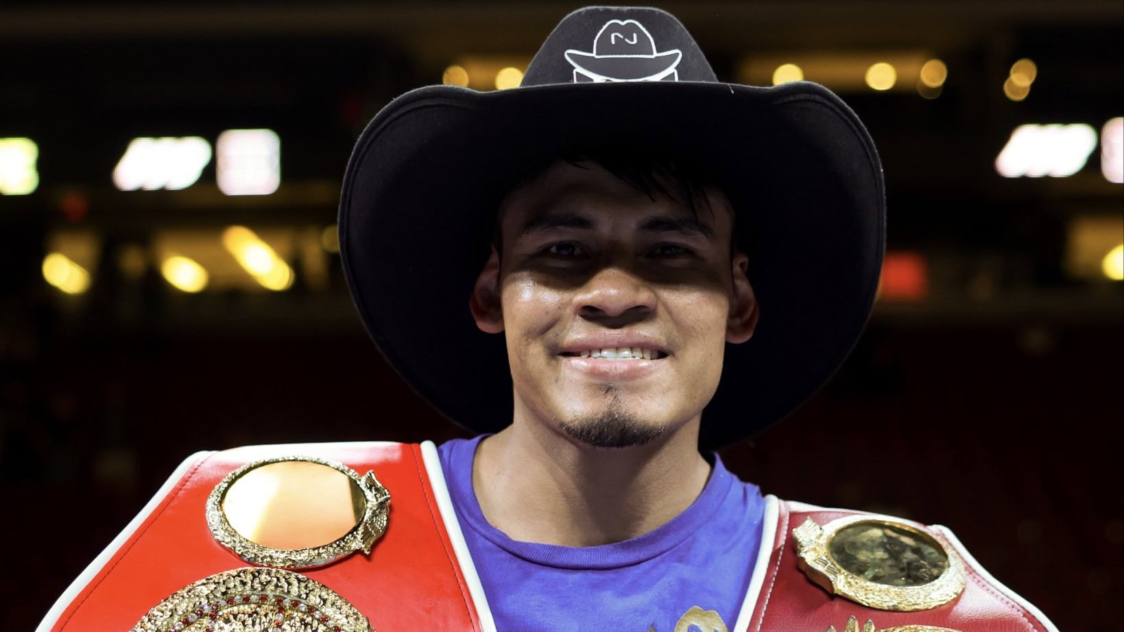 Emanuel Navarrete poses with WBO and IBF super featherweight titles after defeating Eduardo Nunez in 2026