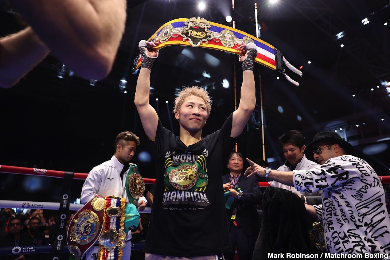 Naoya Inoue raises his championship belt overhead inside the ring after defeating Alan Picasso at the Mohammed Abdo Arena in Riyadh, Saudi Arabia.