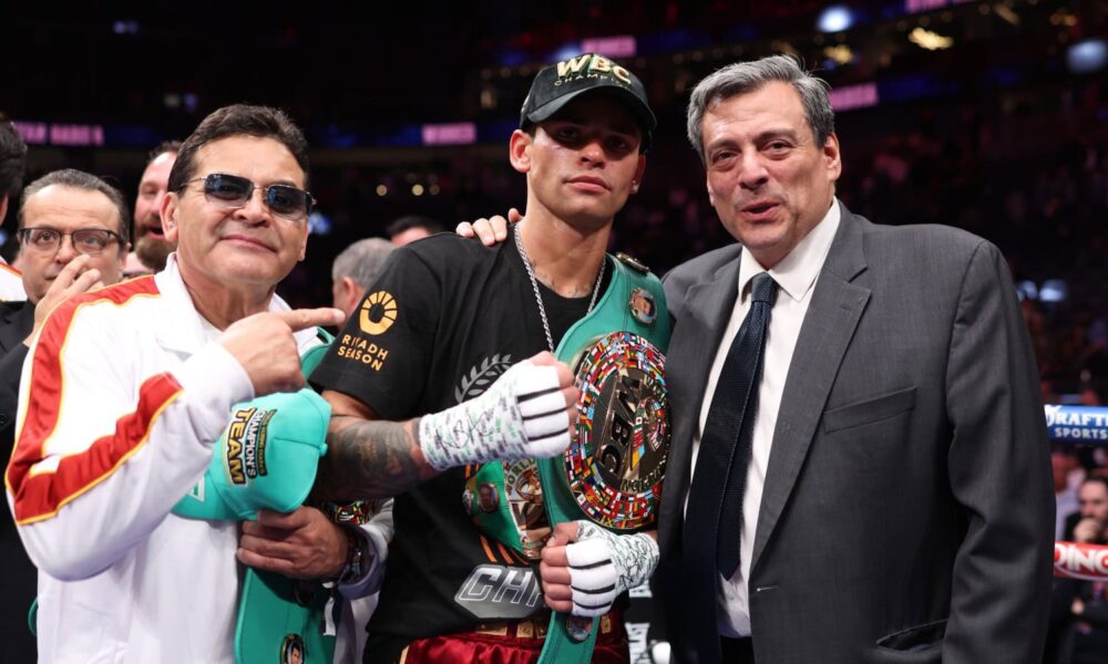 Ryan Garcia poses with WBC President Mauricio Sulaiman and the WBC title belt