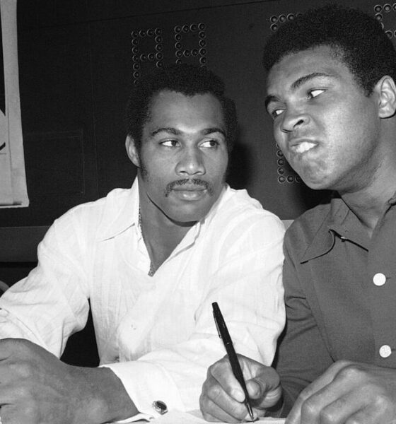 Muhammad Ali and Ken Norton seated together at a press event in 1973