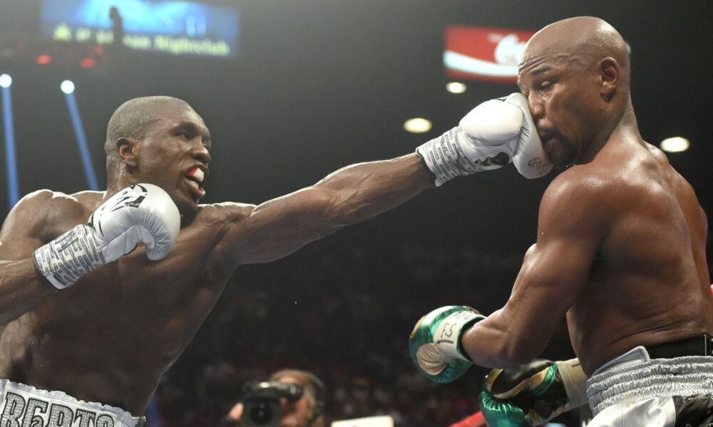 Andre Berto lands a punch on Floyd Mayweather during their 2015 welterweight fight in Las Vegas