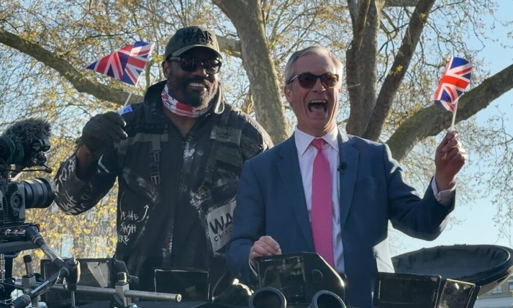 COMMANDER Derek Chisora ARRIVES on a TANK w Nigel Farage!
