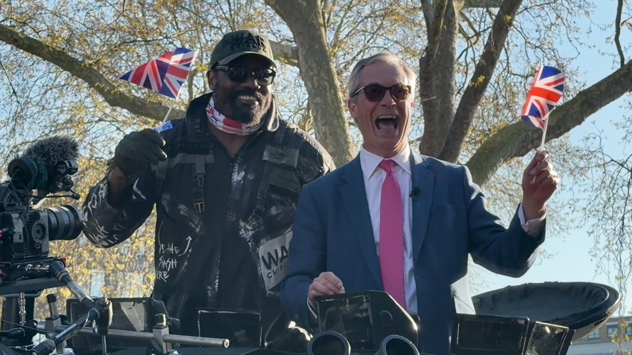 COMMANDER Derek Chisora ARRIVES on a TANK w Nigel Farage!