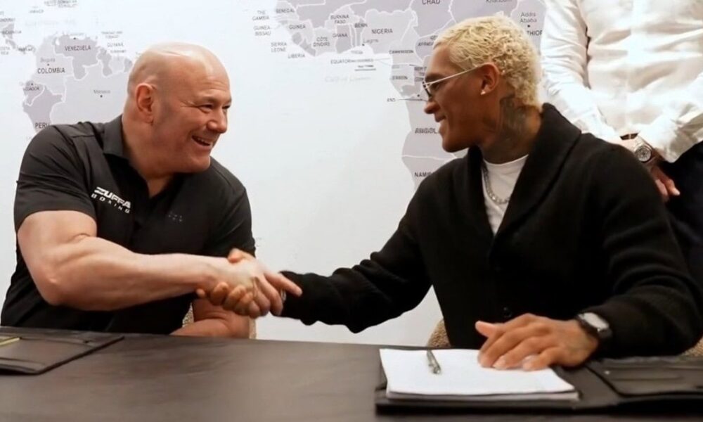 Conor Benn shakes hands with Dana White in Las Vegas after signing an upgraded multi-fight Zuffa deal