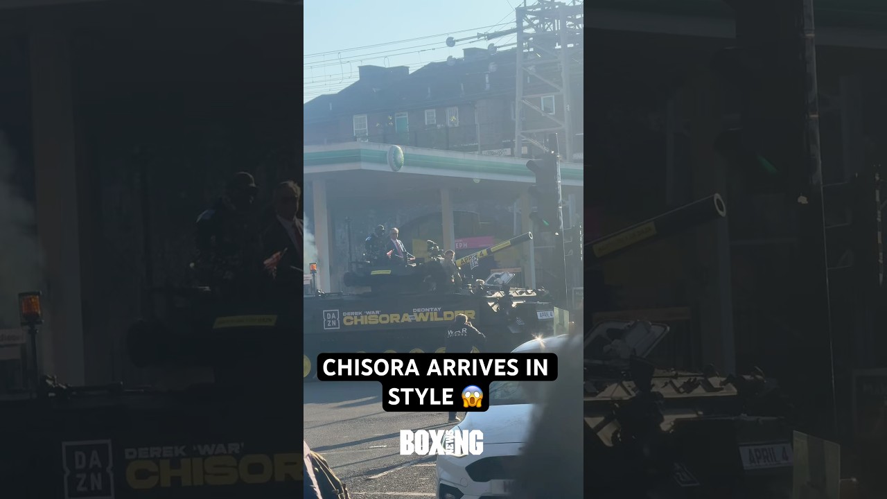 Derek Chisora Arrives To Wilder Press Conference With Nigel Farage On A Tank