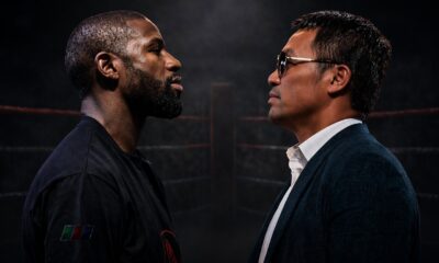Floyd Mayweather and Manny Pacquiao face off in a dark boxing ring, staring intensely at each other ahead of a potential rematch