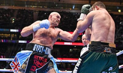 Tyson Fury lands a punch on Arslanbek Makhmudov during their heavyweight fight at Tottenham Hotspur Stadium