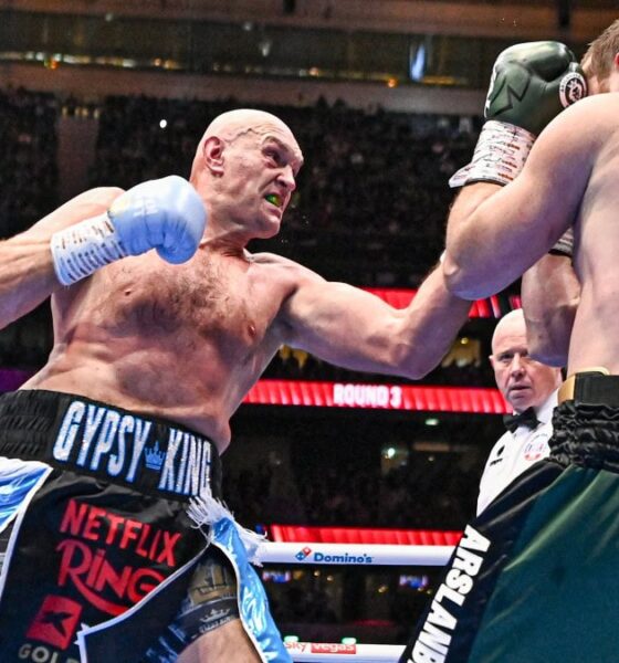 Tyson Fury lands a punch on Arslanbek Makhmudov during their heavyweight fight at Tottenham Hotspur Stadium