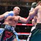 Tyson Fury lands a punch on Arslanbek Makhmudov during their heavyweight fight at Tottenham Hotspur Stadium