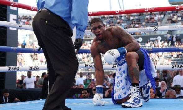 Jared Anderson down on one knee after knockdown during Martin Bakole fight