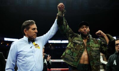 Amari Jones celebrates with his arm raised after stopping former world champion Vincenzo Gualtieri during their middleweight fight in San Jose.