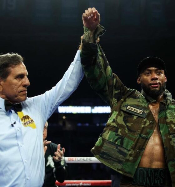 Amari Jones celebrates with his arm raised after stopping former world champion Vincenzo Gualtieri during their middleweight fight in San Jose.