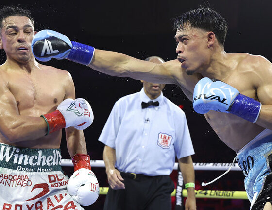 Leo knocked out Lopez and became the world featherweight champion. Photo: Mikey Williams/Top Rank