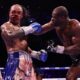 Fabio Wardley takes a heavy right hand from Daniel Dubois during their WBO heavyweight title fight in Manchester as Dubois stages a comeback victory.