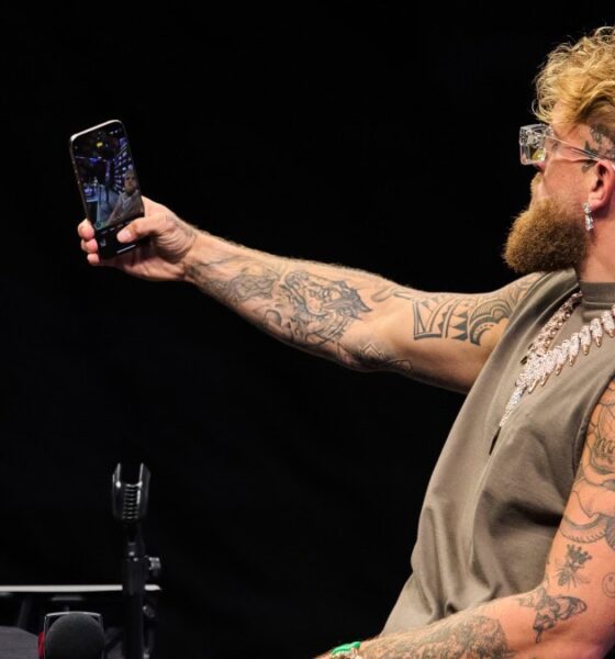 Jake Paul films himself on a phone during a public appearance amid fresh Canelo Alvarez fight speculation.